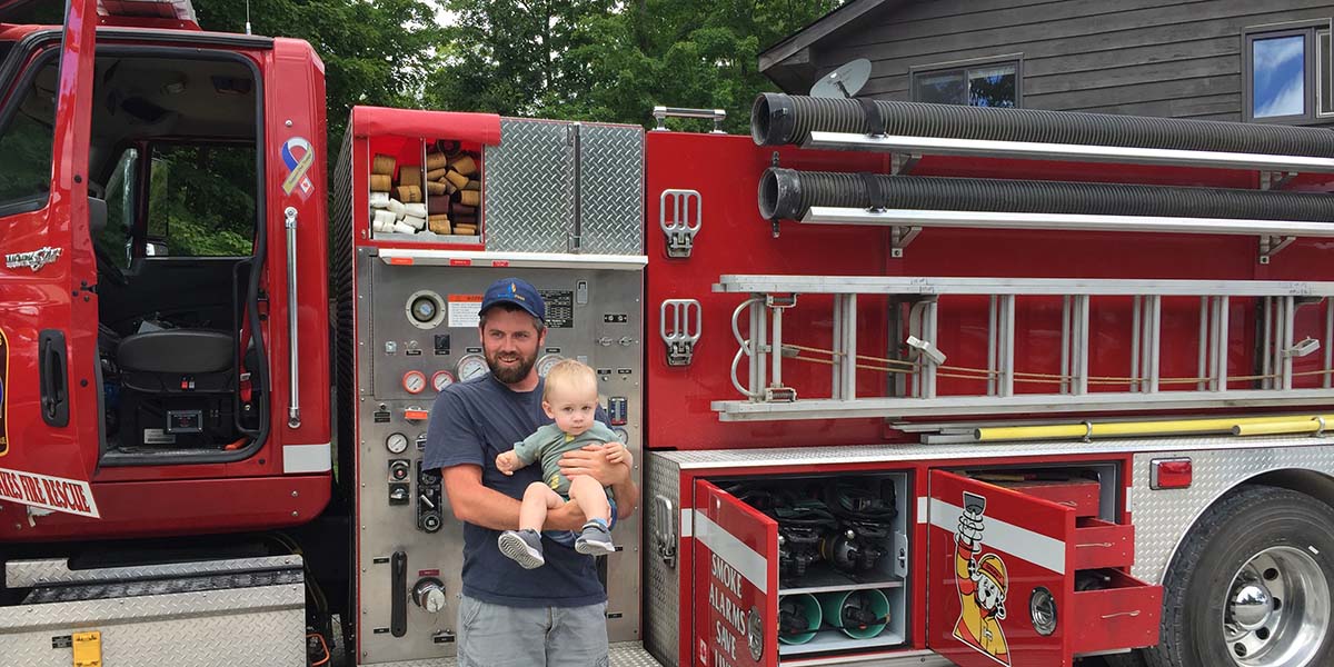 fire truck with father and young son